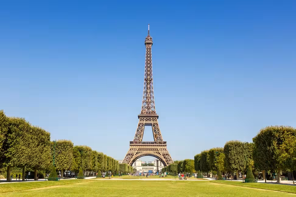 The Eiffel Tower seen from the lawns of the Champ-de-Mars on a clear day
