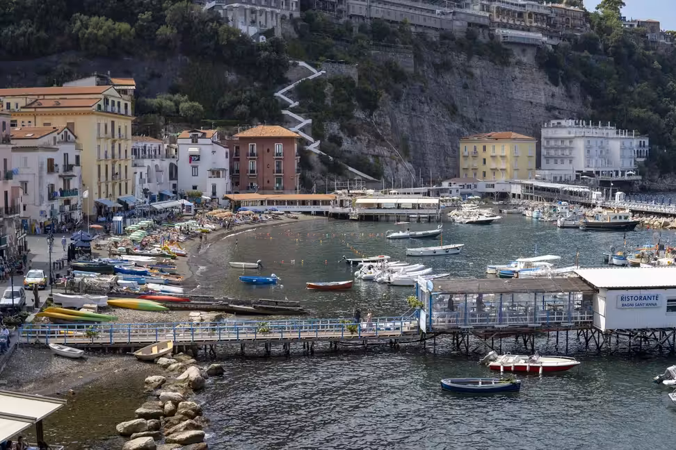 Fishing boats and the small beach of Marina Grande below the cliffs of Sorrento