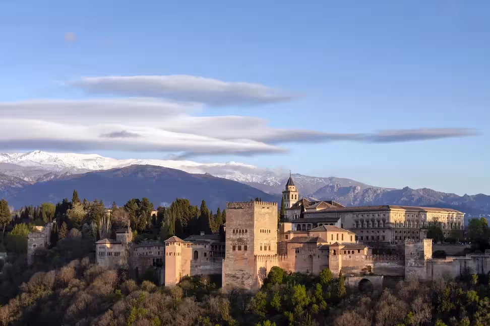 The Alhambra in Granada, with the snowy peaks of the Sierra Nevada behind.