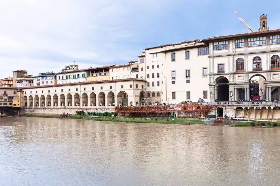 The Uffizi and the arcaded Vasari Corridor along the Arno in Florence.