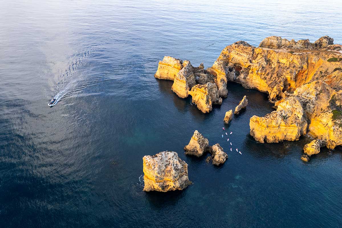 Ponta da Piedade, a stunning collection of dramatic rock formations and sea stacks near Lagos, Portugal, offers breathtaking coastal views, intricate grottos accessible by boat or kayak, and a picturesque lighthouse overlooking the Algarve's azure waters.