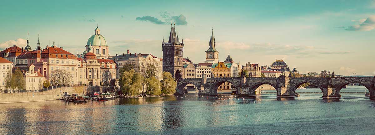 Prague, the Czech Republic's capital, boasts a fairytale cityscape with its iconic Charles Bridge, medieval Old Town Square, and Prague Castle, showcasing Gothic and Baroque architecture against a backdrop of the Vltava River.