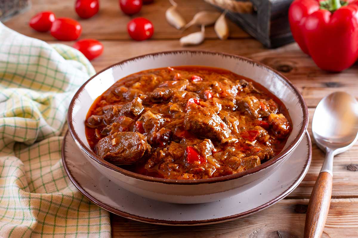 Czech cuisine, known for its hearty dishes like roast pork with dumplings and sauerkraut, rich goulash, and sweet fruit dumplings, offers a flavorful taste of traditional Central European fare.