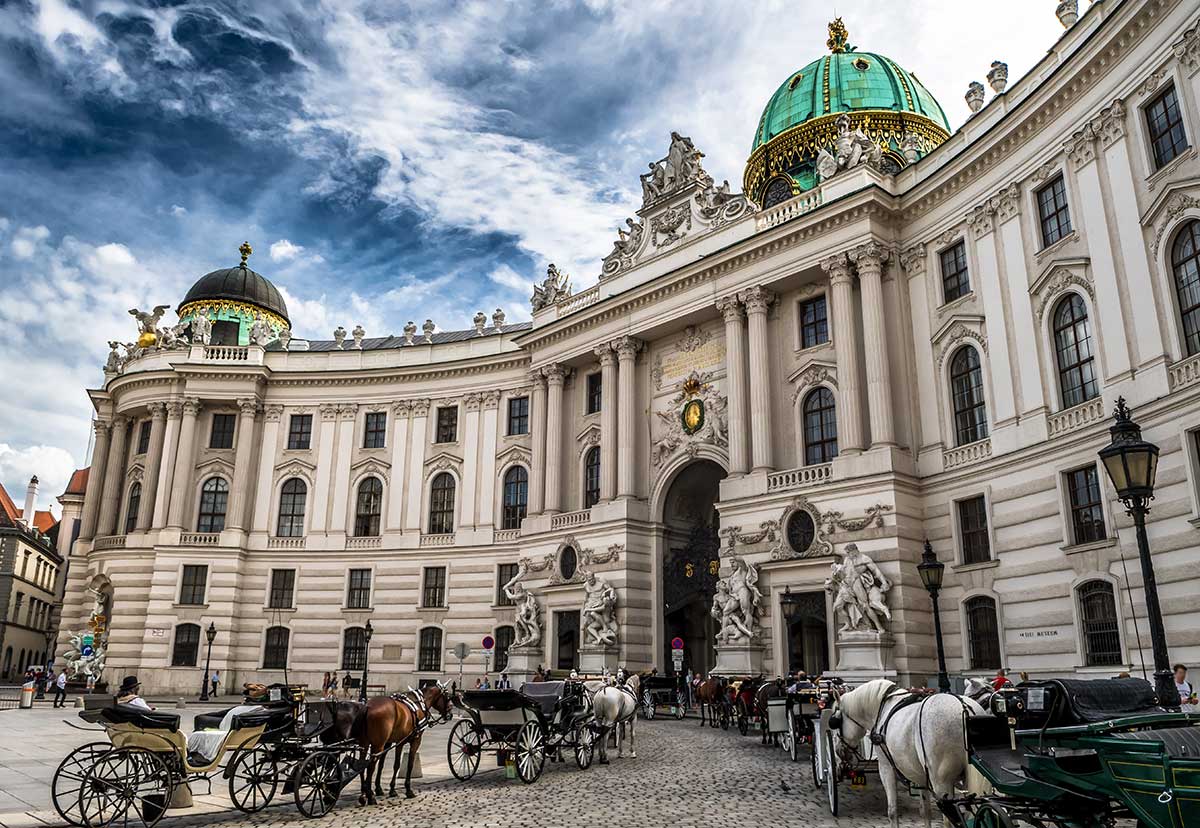 The expansive Hofburg Palace courtyard, a historical hub within Vienna, showcases the architectural grandeur of the Habsburg dynasty, where imperial ceremonies and daily life intersected amidst the stately facades.