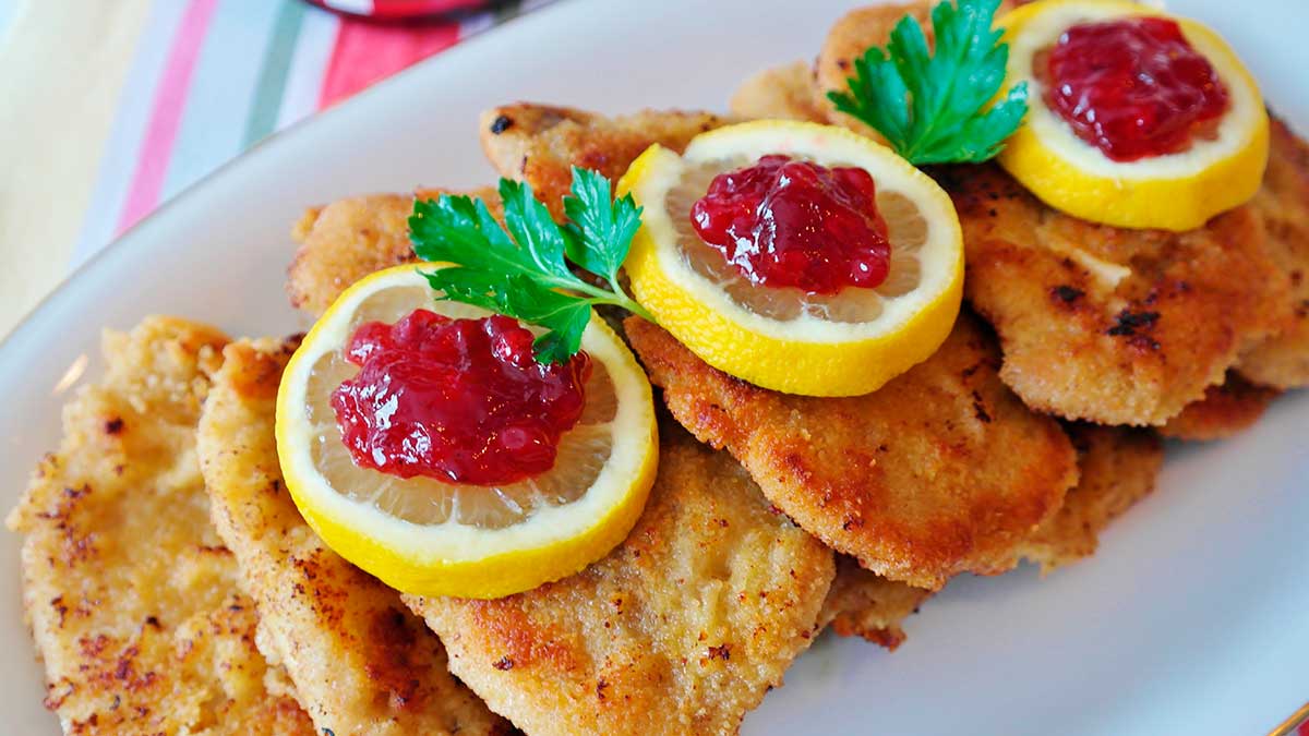 The classic Wiener Schnitzel, a delicate veal cutlet meticulously breaded and pan-fried to a golden crisp, is a culinary icon of Vienna, traditionally served with a side of potato salad and a lemon wedge.