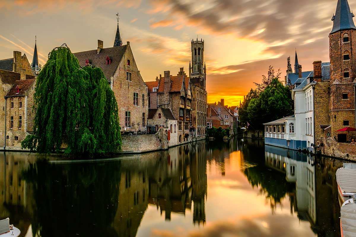 Bruges canal tour at sunset, romantic travel experience