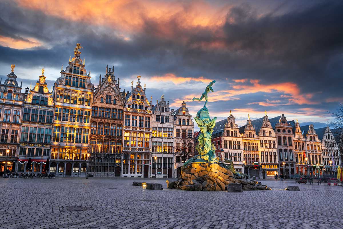 The Grote Markt in Antwerp, Belgium, features ornate guildhalls with gilded facades, the Renaissance-style City Hall, and the iconic Brabo Fountain, showcasing the city's rich history and architectural splendor in a bustling central square.