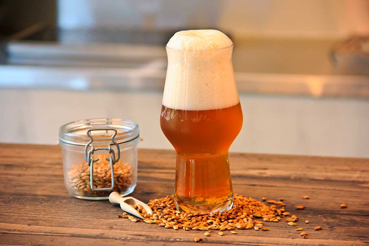 Belgian beer, renowned for its diverse styles, including Trappist ales and lambics, is often served in specialized glassware, showcasing the country's rich brewing heritage and complex flavors.
