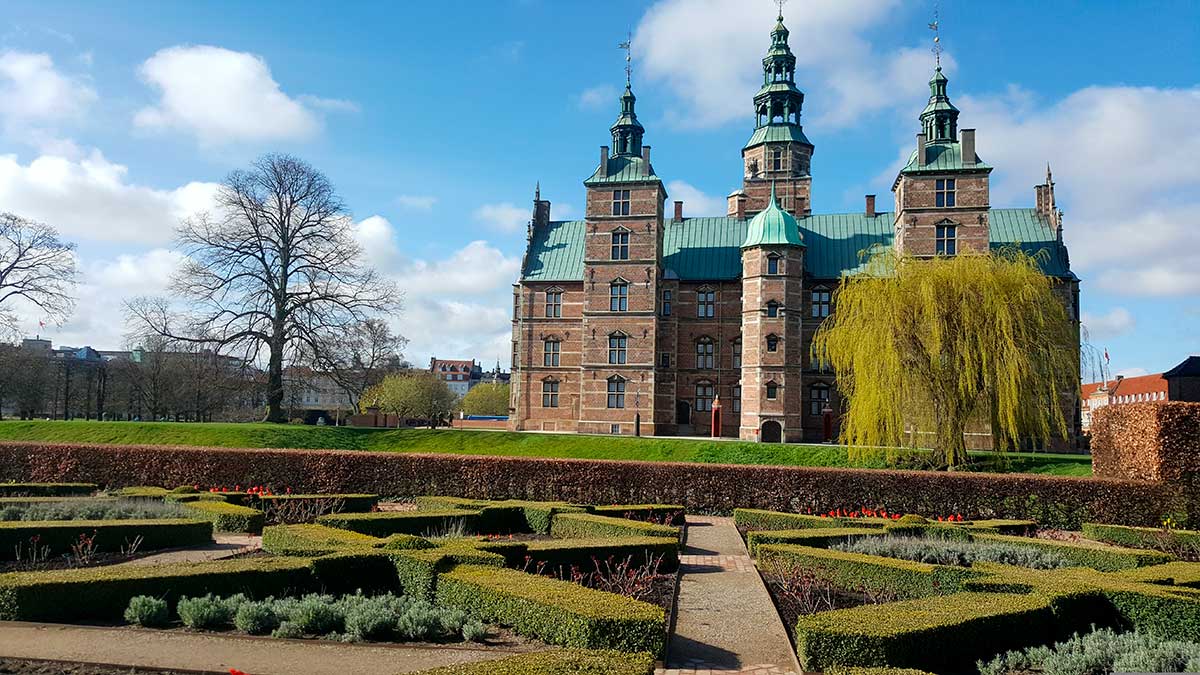 Rosenborg Castle in Copenhagen, Denmark, showcases Renaissance architecture, houses the Danish Crown Jewels, and features opulent interiors, offering visitors a glimpse into royal history and artifacts within its historic walls and gardens.