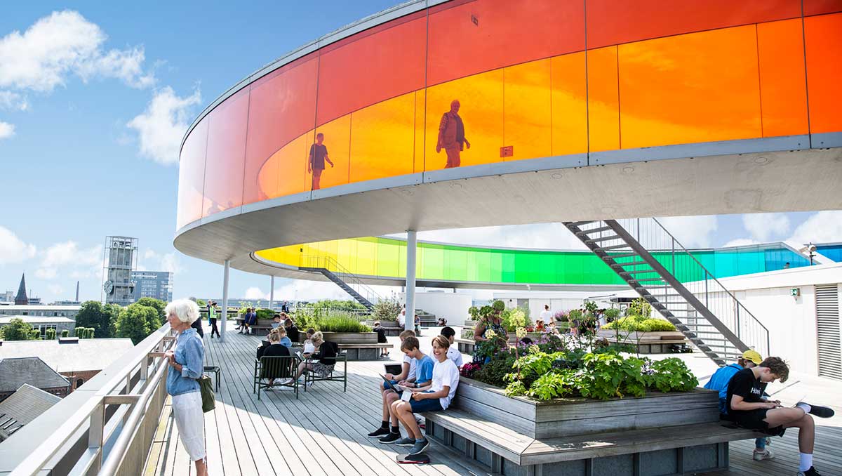 ARoS Aarhus Art Museum in Denmark features a striking rainbow panorama walkway atop its building, offering panoramic city views and showcasing contemporary art exhibitions within its modern, multi-level galleries.