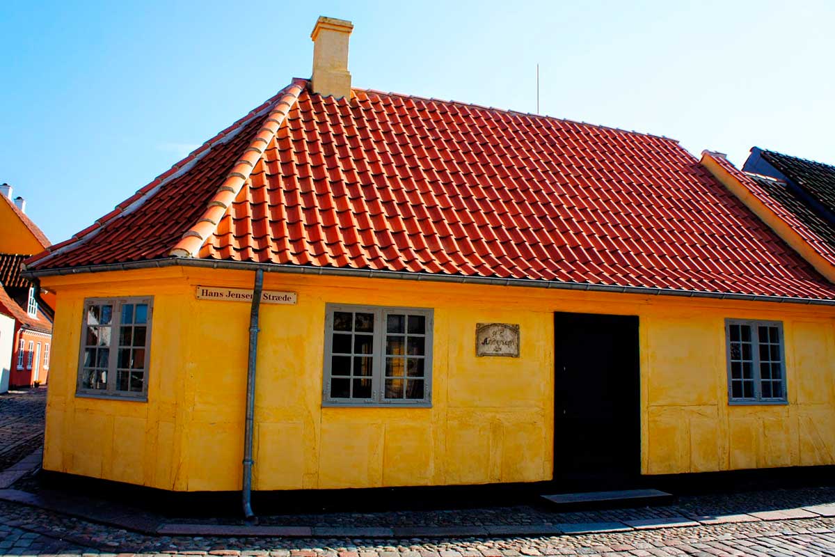 Hans Christian Andersen's House in Odense, Denmark, displays artifacts and exhibits showcasing the author's life, writings, and fairy tales, offering visitors a glimpse into the world of the beloved storyteller.