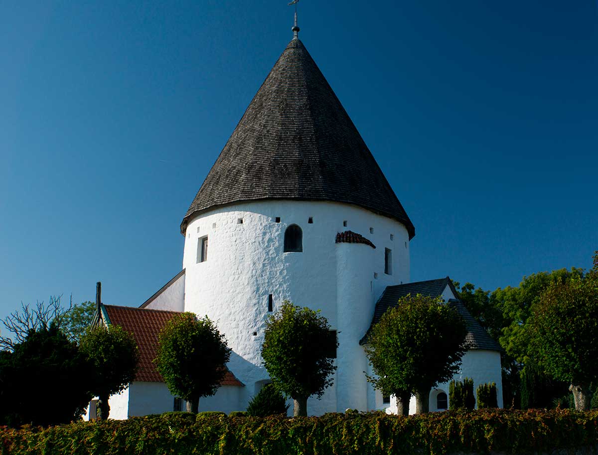 The round churches of Bornholm, Denmark, featuring distinctive circular designs with fortified upper levels, stand as unique medieval architectural landmarks, reflecting the island's history and defensive needs.