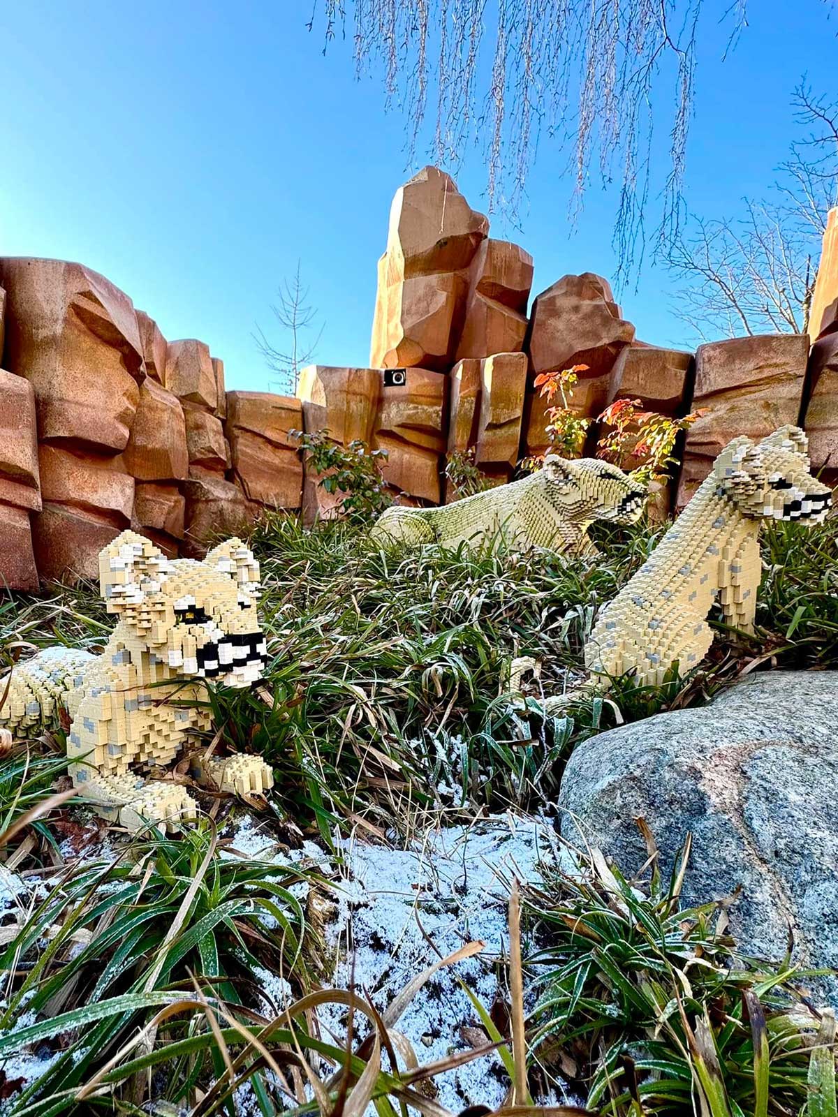 LEGOLAND Billund, Denmark, features intricate LEGO brick models of famous landmarks, thrilling rides, and interactive play areas, providing a family-friendly amusement park experience centered around the iconic building blocks.