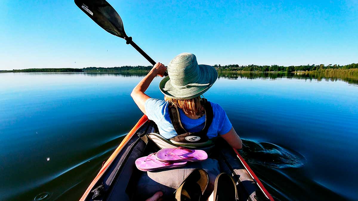 Kayaking in the Finnish Lakeland offers a serene experience, paddling through pristine lakes and waterways surrounded by lush forests and tranquil islands, showcasing the region's natural beauty and outdoor adventure opportunities.