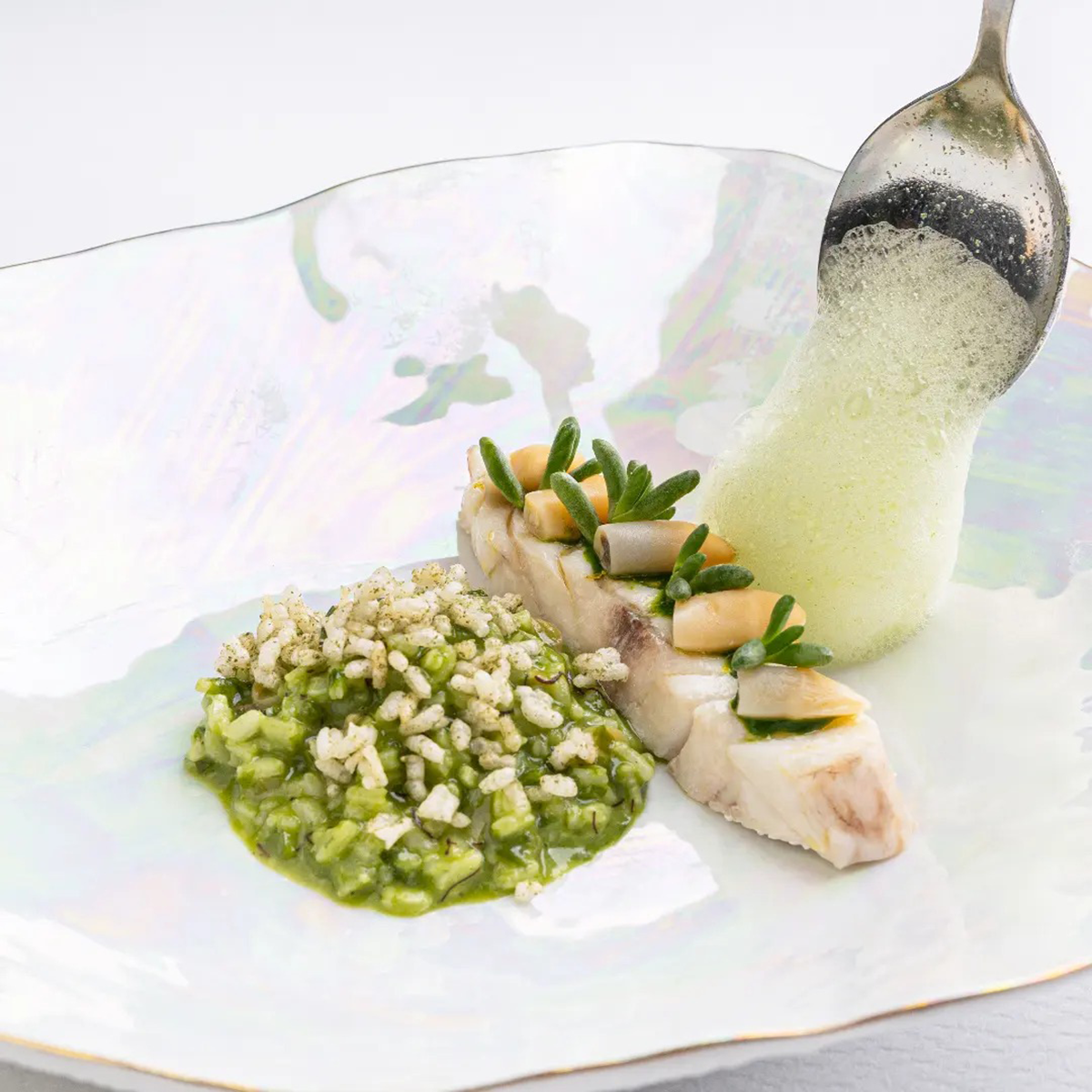 Gourmet dishes served at Vistas Monte Rei, presented with artistic flair, demonstrating the restaurant's focus on high-quality cuisine and refined dining.