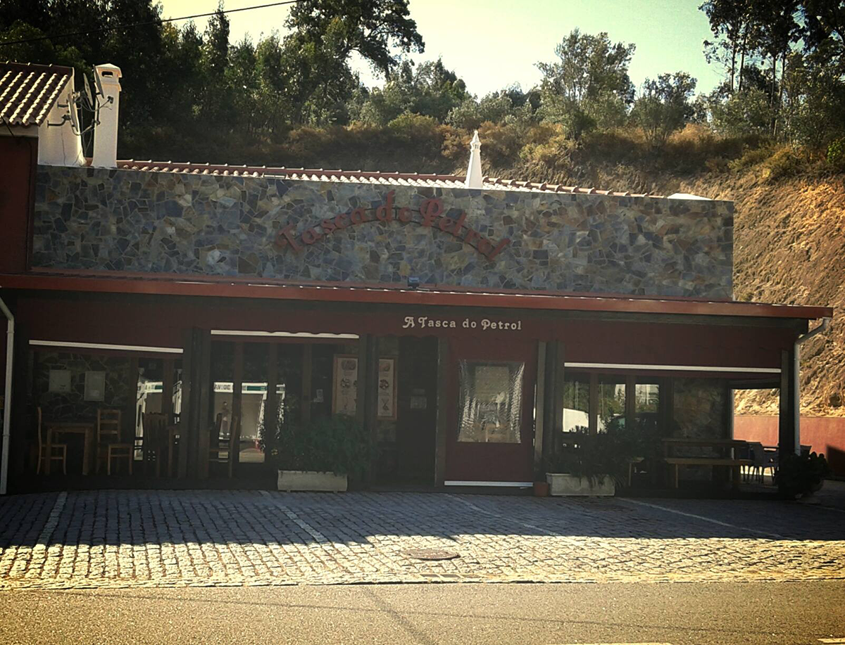 Rustic setting at Tasca do Petrol, emphasizing its traditional Portuguese charm and selection of regional specialties.