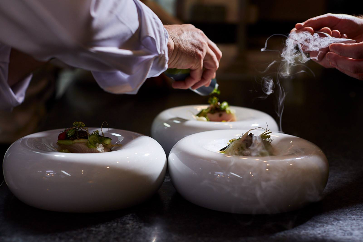 Oceanfront terrace at Vila Joya Restaurant, highlighting the restaurant's scenic location and exceptional culinary experience.