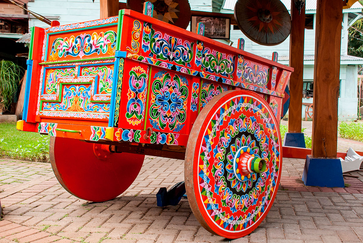 The iconic, brightly painted oxcarts of Costa Rica, a testament to the country's rich cultural heritage, showcase intricate, hand-painted designs that reflect local artistry and history, making them a beloved symbol of traditional craftsmanship and "Pura Vida."