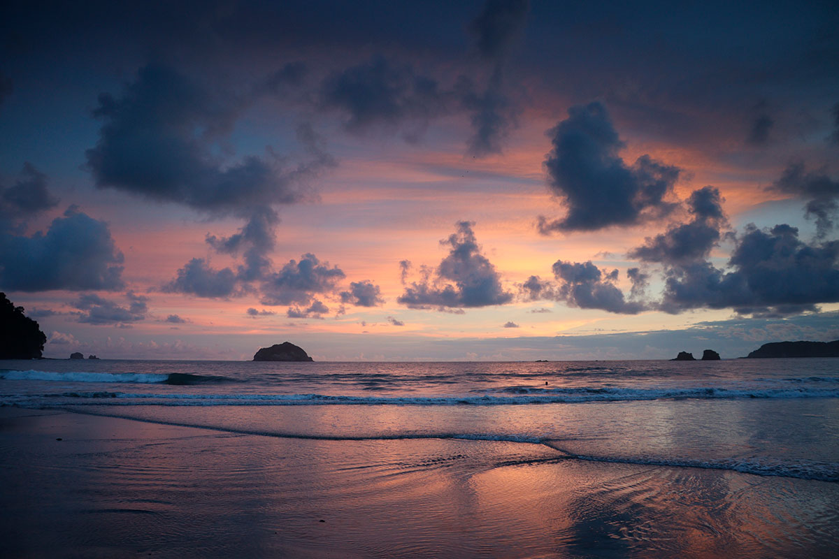 As the sun dips below the horizon, Costa Rica's pristine beaches transform into a canvas of vibrant hues, offering breathtaking sunset views that illuminate the Pacific and Caribbean coastlines, creating a serene and unforgettable "Pura Vida" moment.