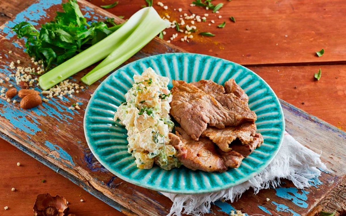 "Plumas de porco preto," a prized delicacy in Portuguese cuisine, features succulent cuts of Iberian black pig, renowned for their exceptional marbling and nutty flavor, typically grilled or pan-seared to perfection, highlighting the richness of this heritage breed.