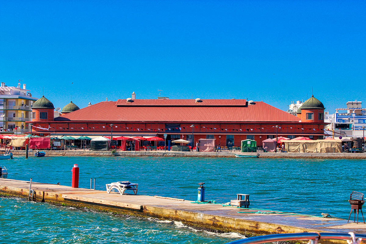 The vibrant Olhão Market, a bustling hub in the Algarve, showcases the region's rich maritime heritage, offering an abundance of fresh seafood, locally grown produce, and regional specialties within its distinctive red-brick buildings.