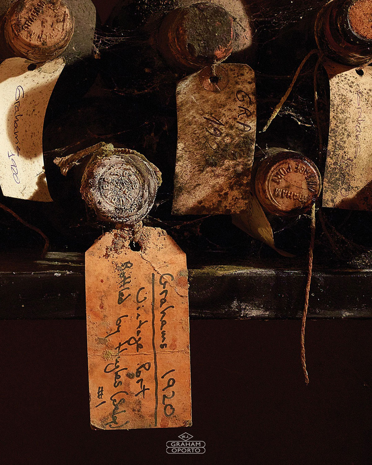 Graham's Lodge in Porto, Portugal, features a historic Port wine cellar with aged oak barrels, showcasing the traditional aging process and offering tastings within a classic, rustic setting overlooking the Douro River.