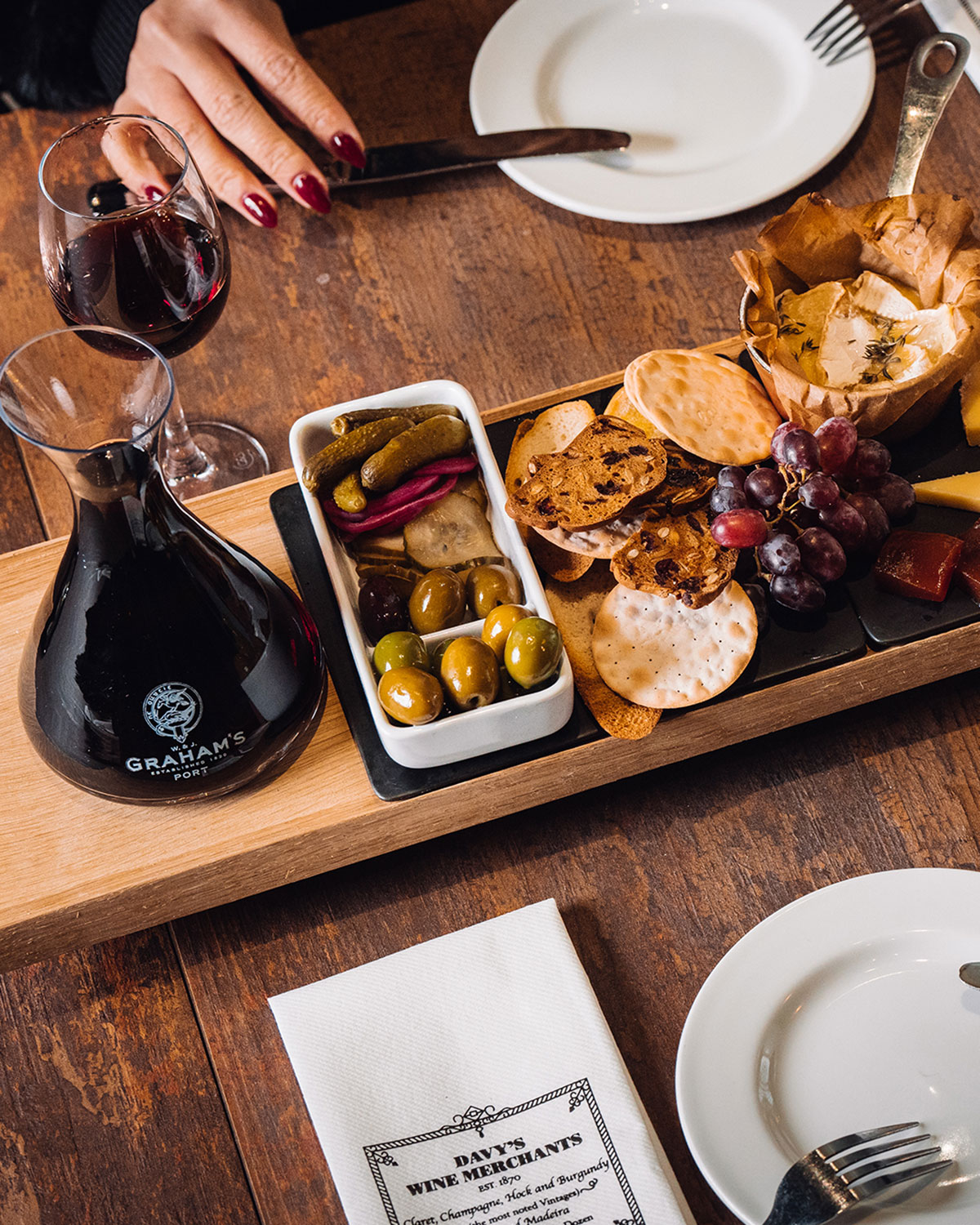 Port wine pairing with food in Porto features a selection of cheeses, chocolates, and pastries alongside various Port styles, showcasing the harmonious blend of sweet and savory flavors in a traditional tasting experience.