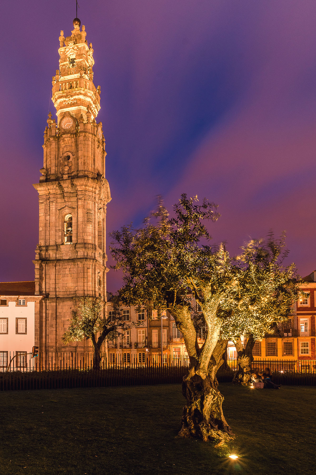 The Clérigos Tower in Porto, Portugal, features a Baroque bell tower offering panoramic city views from its summit, showcasing its intricate stonework and historical significance as a prominent city landmark.