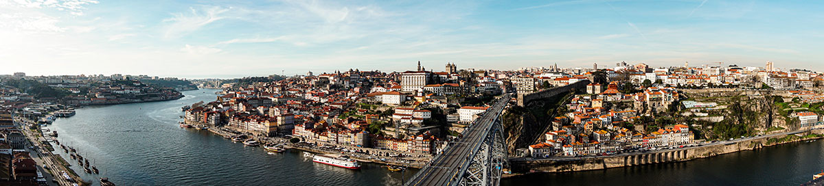 Vila Nova de Gaia, Portugal, lines the Douro River with historic Port wine cellars, showcasing rows of aging barrels and offering tours and tastings that highlight the region's rich wine-making tradition and scenic riverfront views.Vila Nova de Gaia, Portugal, lines the Douro River with historic Port wine cellars, showcasing rows of aging barrels and offering tours and tastings that highlight the region's rich wine-making tradition and scenic riverfront views.