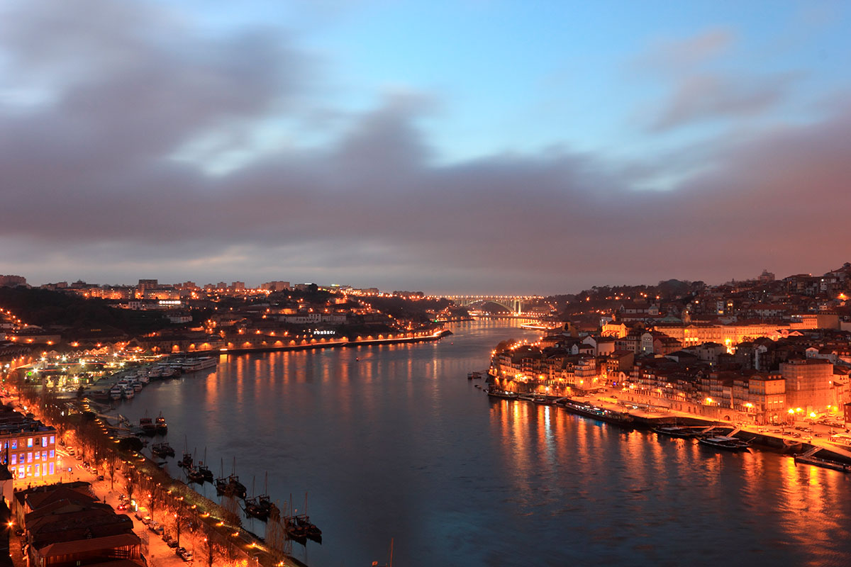 Foz do Douro, in Porto, Portugal, features a scenic coastline where the Douro River meets the Atlantic Ocean, showcasing sandy beaches, rocky outcrops, and a picturesque promenade, offering stunning sunset views and a blend of river and sea landscapes.