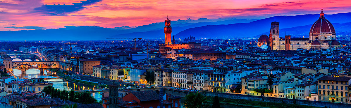 Florence at sunset bathes the Arno River and its iconic Ponte Vecchio in warm golden light, highlighting the terracotta rooftops and Renaissance architecture of the city, creating a picturesque and romantic cityscape.