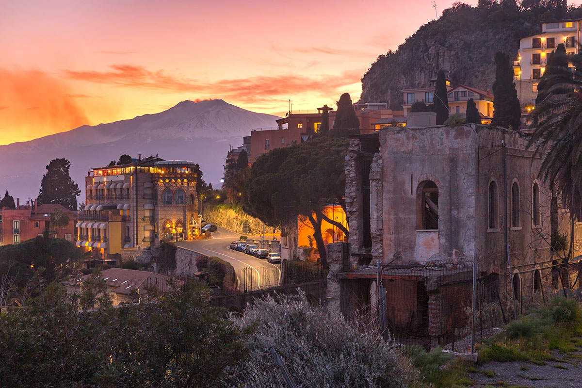 Sicily, Italy, features diverse landscapes including Mount Etna's volcanic slopes, ancient Greek temples, and sandy Mediterranean beaches, showcasing its rich history, cultural heritage, and vibrant coastal scenery.