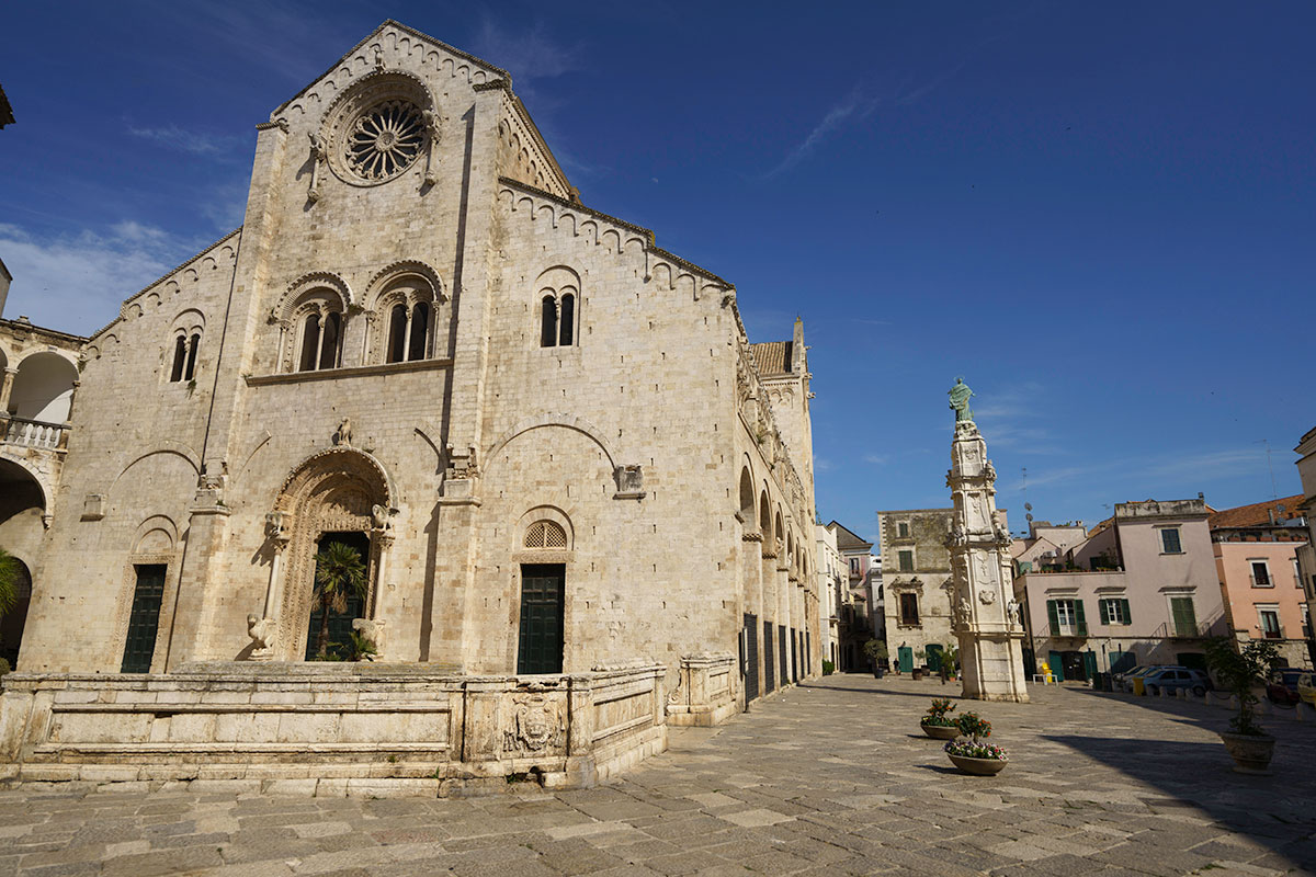 Basilica di San Nicola in Bari, Italy, features a Romanesque facade, a crypt housing the relics of St. Nicholas, and ornate interiors, showcasing its historical and religious significance as a major pilgrimage site.
