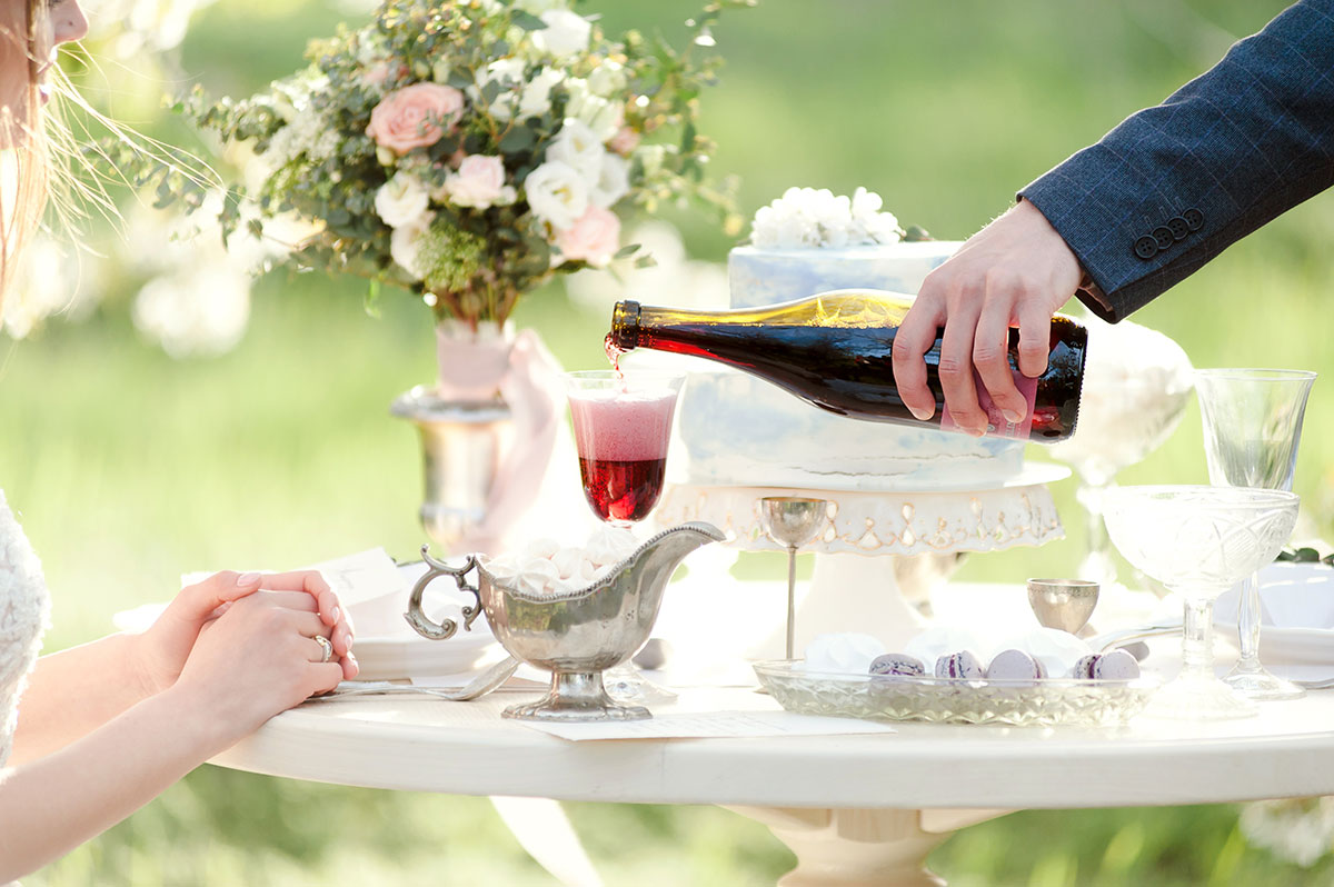 Beautiful served wedding dinner table outside