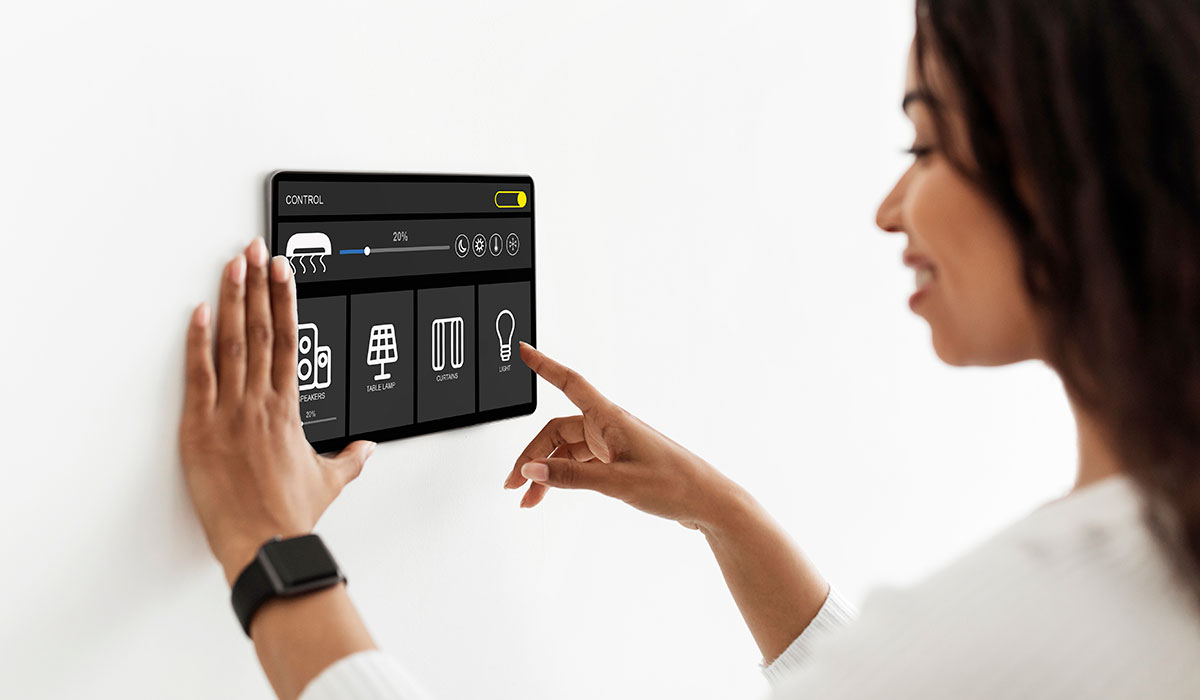 Pretty woman using smart home device