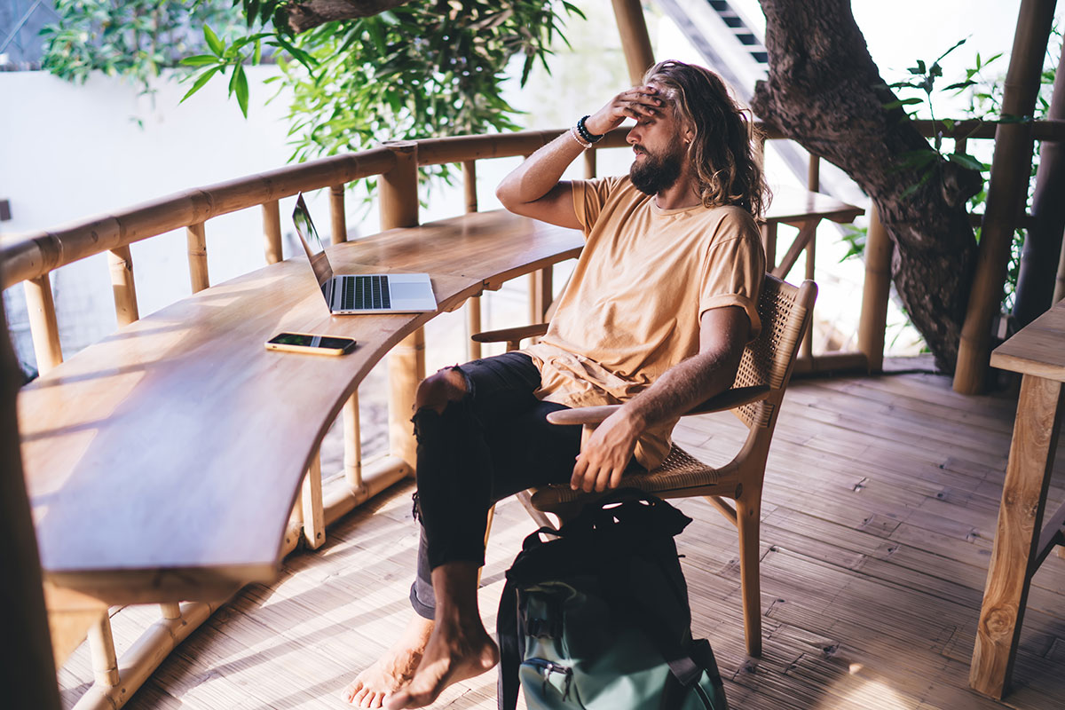 A digital nomad working in a sustainable coworking space in Romania.