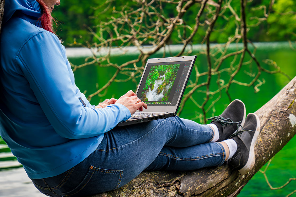 A traveler booking a sustainable budget tour online.
