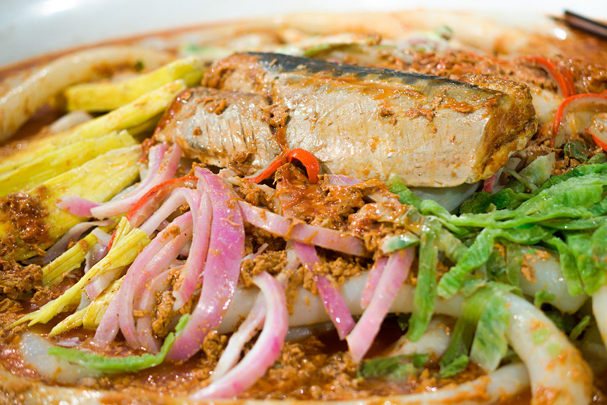 Laksa is a flavorful and aromatic Peranakan dish, popular in Malaysia and Singapore, featuring a rich and creamy coconut-based broth infused with spices, noodles, and various toppings like seafood, chicken, or tofu.