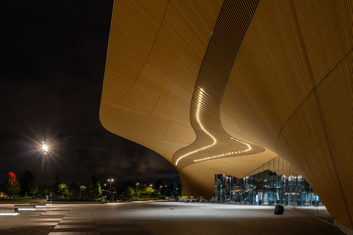 A vibrant street in Helsinki’s Design District featuring colorful boutique shops and street art.