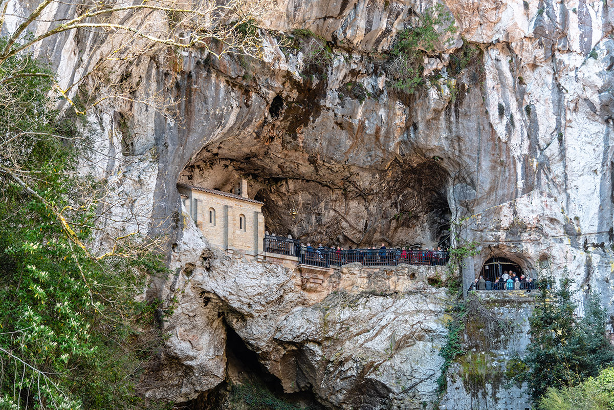 A hiker walking along a scenic trail in the Lousios Gorge