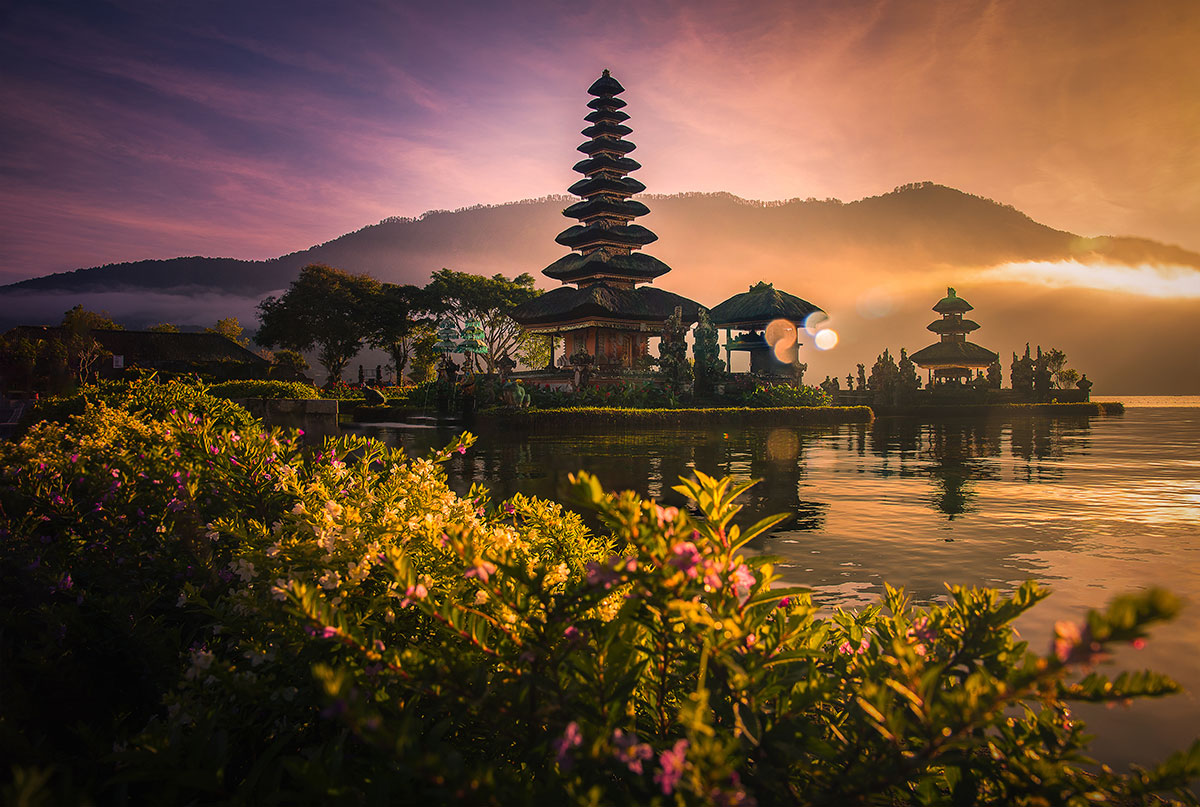 Bali temple at sunrise with ocean view