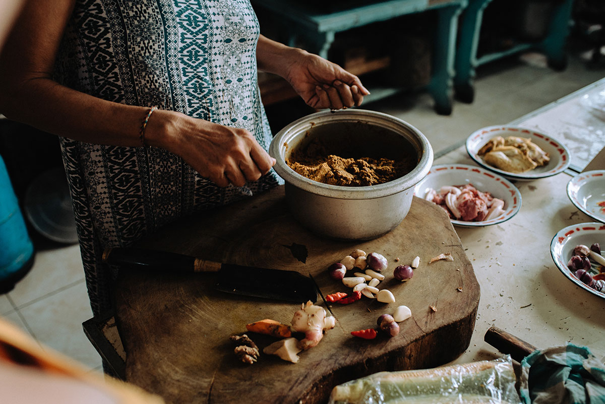 Tourists learning traditional Balinese cooking