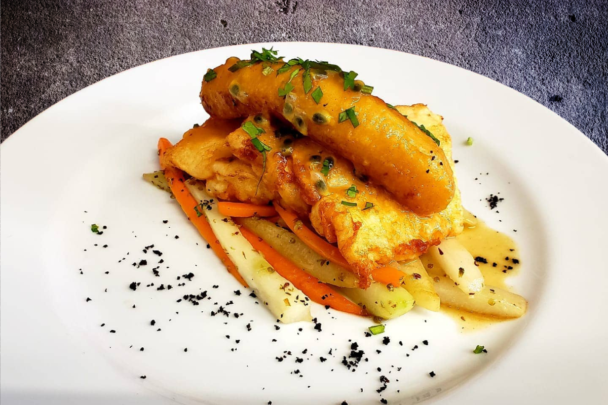 Black scabbard fish fillet served with fried banana and passionfruit sauce