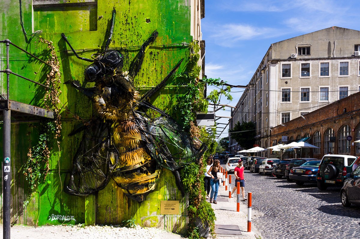 3D bee sculpture made from recycled materials by Bordalo II at Lisbon's LX Factory.