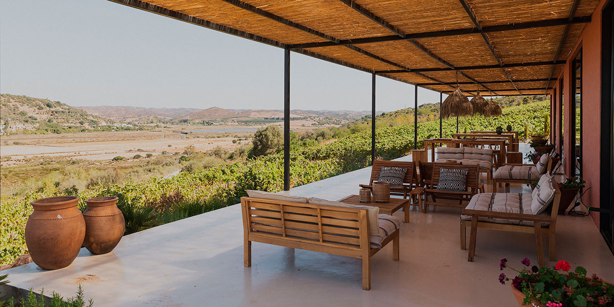 Vineyards and tasting terrace at Arvad Wine overlooking the Arade River in the Algarve, Portugal.