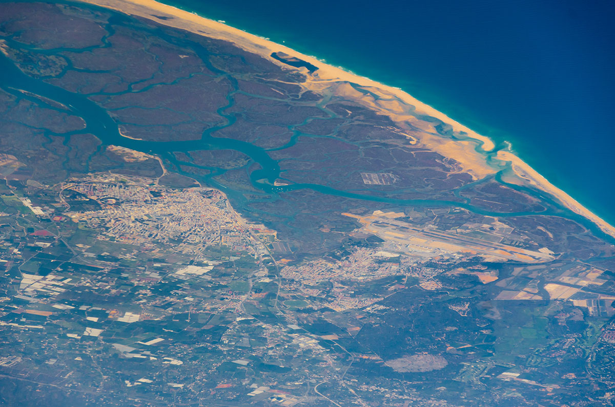 Aerial photograph showcasing the diverse landscapes of Ria Formosa Natural Park.​