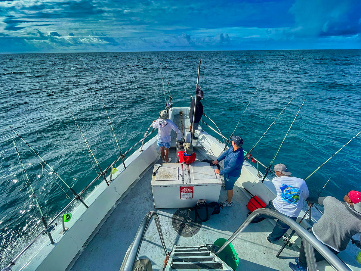 Tourists enjoying a fishing charter with local guides in the Azores.