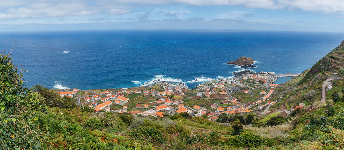Rugged volcanic coastline of Porto Moniz with waves crashing