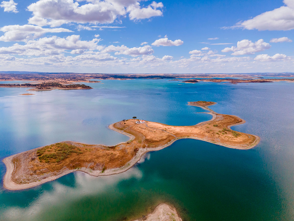 Tranquil waters of Alqueva Lake at sunset