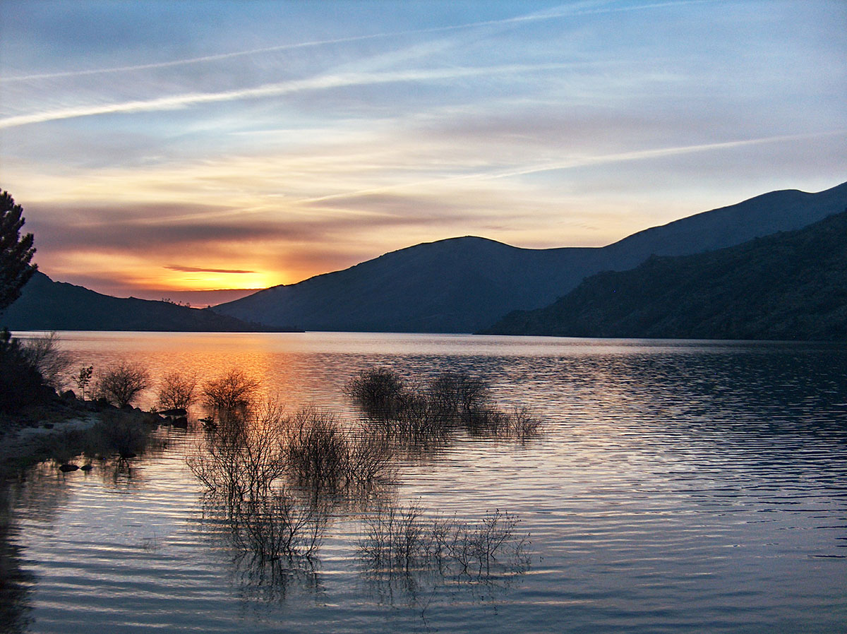 A scenic sunset casting golden hues over the hills of Peneda-Gerês.